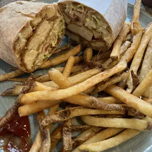 Honey Chicken Cutlet on a wheat wrap with fries.