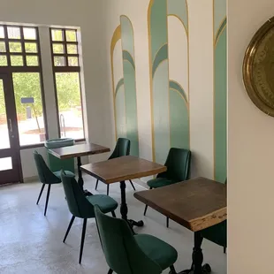 a dining room with a clock on the wall