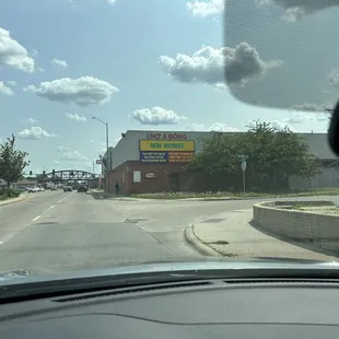 a view of a street from inside a car
