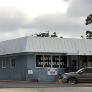 a truck parked in front of the restaurant