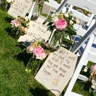 The ceremony lined with beautiful quotes, signs by Save the Date Events, florals by Sweet Lilacs Studio