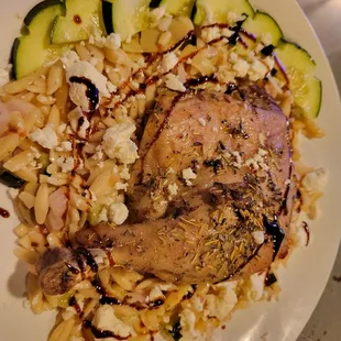 Duck leg confit over Greek orzo salad.