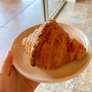 a croissant on a plate