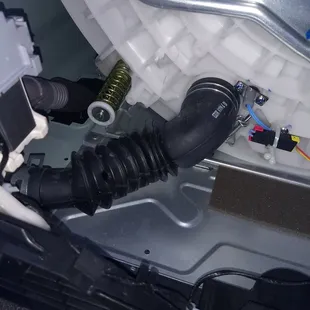 Hole in drain tube under machine.