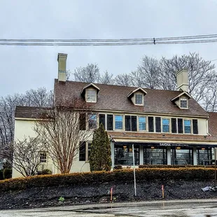 a house on a corner of a street