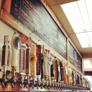 a row of beer taps