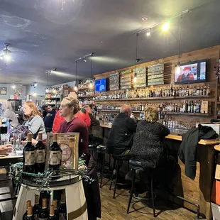 a group of people sitting at a bar