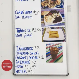 a menu on the side of a food truck