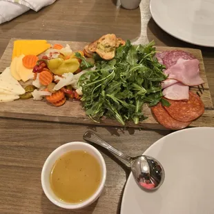 The charcutarie board and soup that came with the meail.