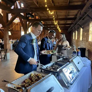a man in a suit serving food