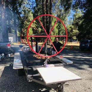 a man cooking food on a grill