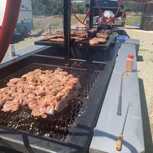 meat being cooked on a grill
