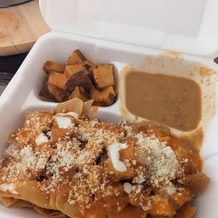 a meal in a styrofoam container