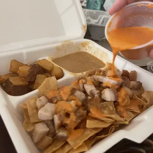 Pouring the sauce on the chilaquiles! Packing the sauce on the side was a smart move to keep the chips crispy!