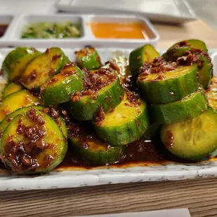 a plate of zucchini with sauce