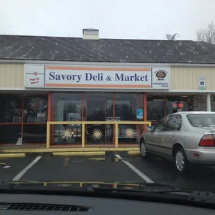 a car parked in front of the store