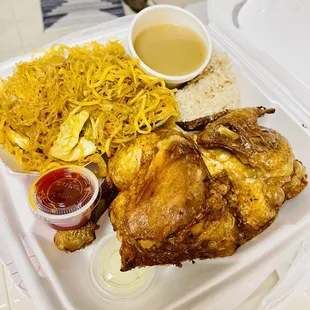 Half fried chicken combo with pancit and garlic rice.