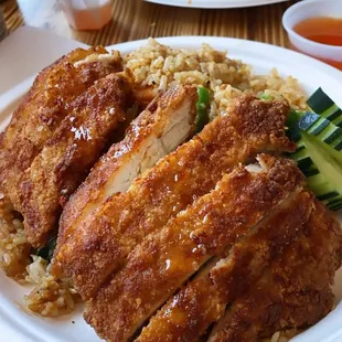 Crispy chicken over fried rice