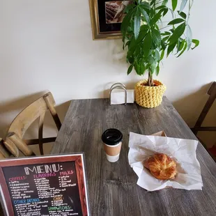 Coffee and a Ham, egg + cheese croissant sandwich