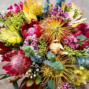 The yellow walls at Cafe echo the happiness from a protea bouquets