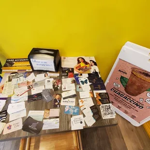 Lots of business cards on the community table