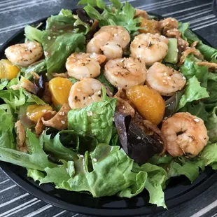 a salad with shrimp and lettuce