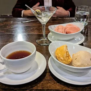 a cup of tea and two bowls of ice cream