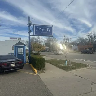 Parking booth and street sign for the Savoy