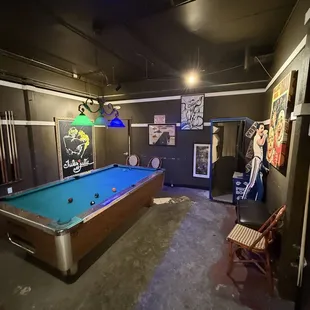 Room in the back with free pool table
