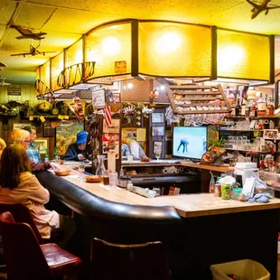 a group of people sitting at a bar