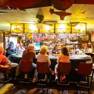 people sitting at a bar