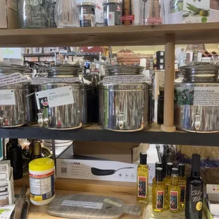 a shelf full of jars of food