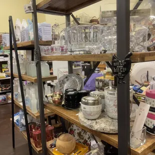 a shelf full of glassware