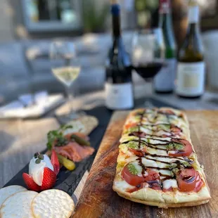 a pizza on a wooden cutting board