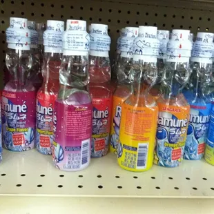 a shelf full of sodas