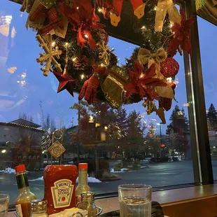 a christmas wreath in the window