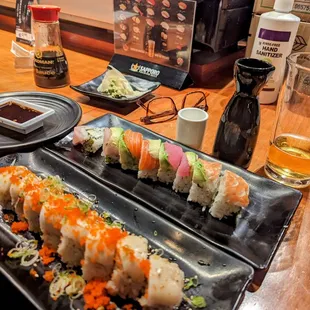 two plates of sushi on a table