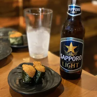 a beer and a plate of food