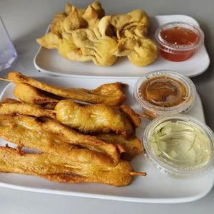 Chicken satay and jalapeño cream cheese wontons