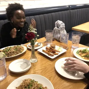 Pad thai, fried rice, and chicken skewers.