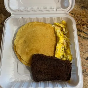 a breakfast in a styrofoam container
