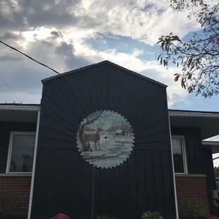 a picture of a building with a deer on it