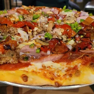 a pizza with meat and vegetables