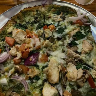 a pizza on a silver platter