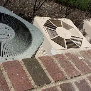 The three loud air conditioning units over our patio wall.