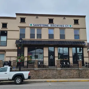 a truck parked in front of a building