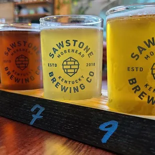 a flight of beers on a table