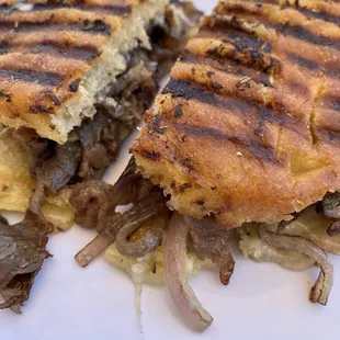 Grilled ribeye, cheese, caramelized onions, on grilled focaccia.