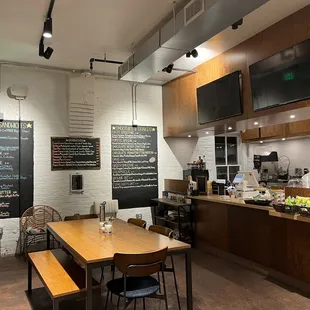 a restaurant with a long wooden table