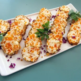 Dried apricot and goat cheese rolled in toasted pistachio nuts